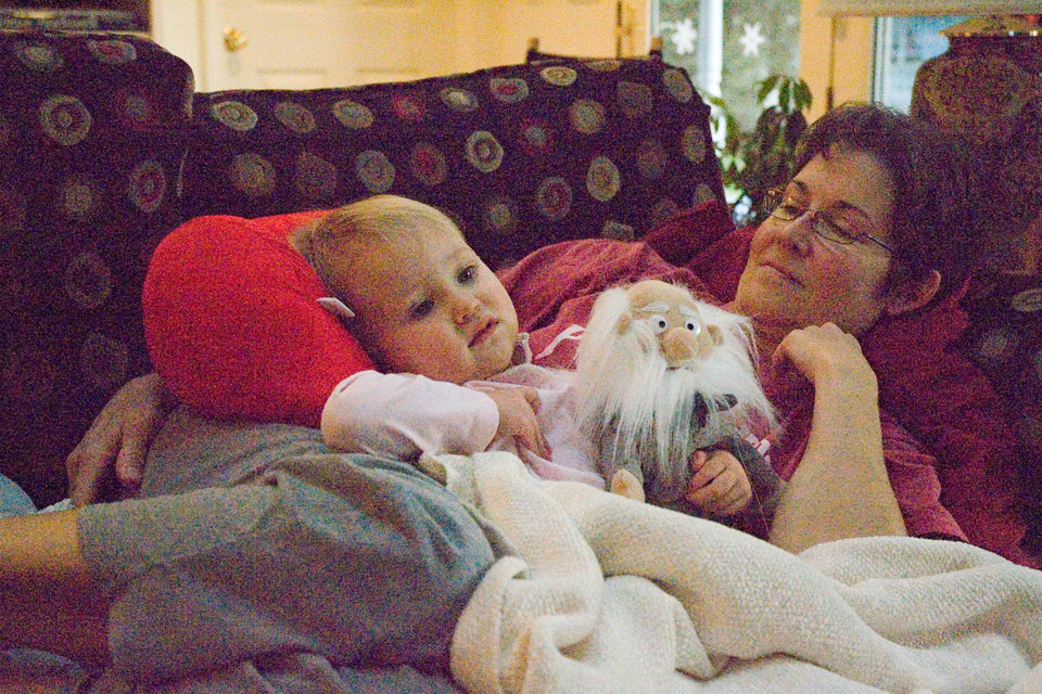 Sick Sophia Resting With Grandma and Darwin
